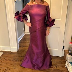 Beautiful new with tags never worn plum formal gown.  Size 16 altered to size 12
